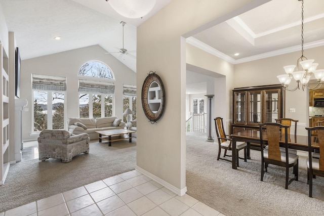 living room featuring ceiling fan with notable chandelier, light colored carpet, high vaulted ceiling, and ornamental molding