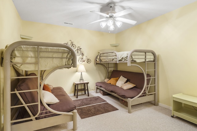 living area featuring ceiling fan and light colored carpet