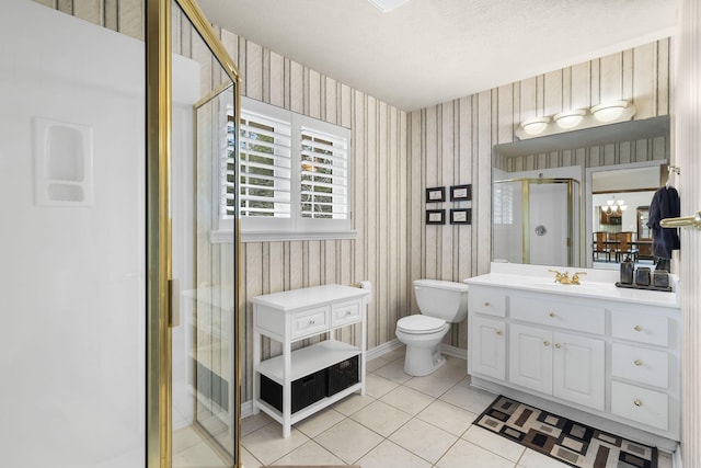 bathroom with walk in shower, tile patterned floors, a textured ceiling, toilet, and vanity