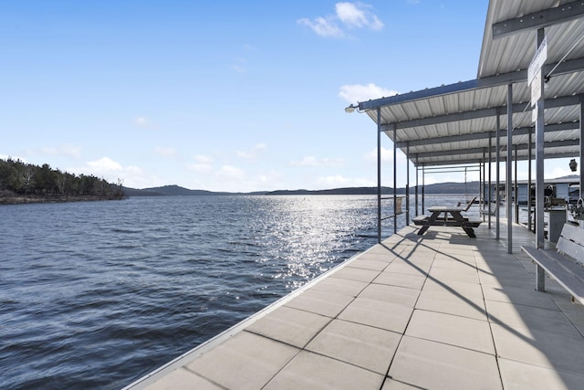 dock area featuring a water and mountain view