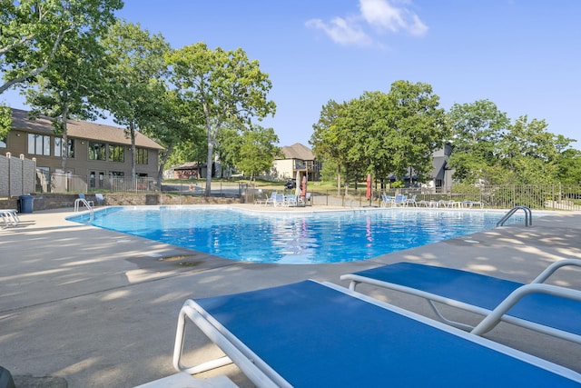 view of swimming pool featuring a patio area