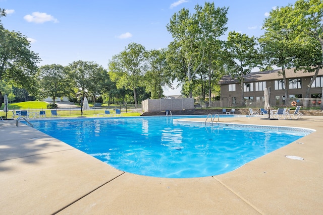 view of swimming pool featuring a patio area