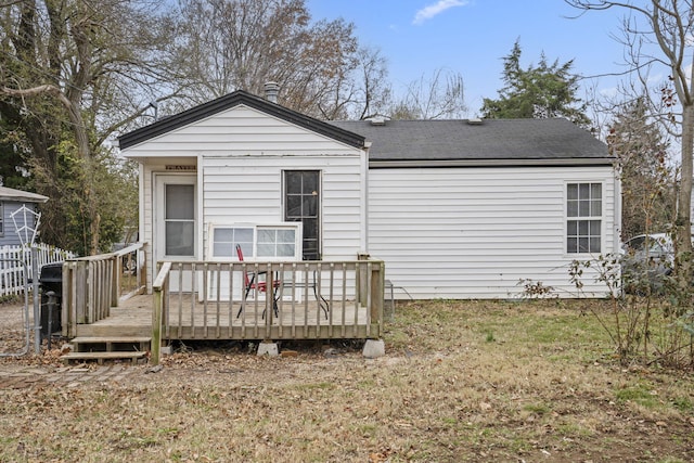 back of house featuring a deck