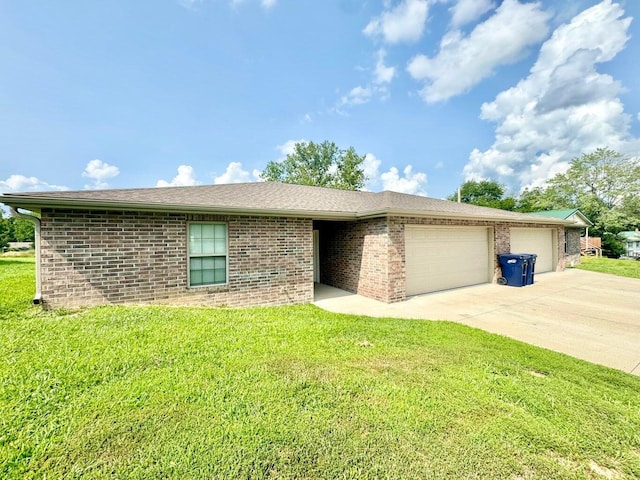 ranch-style home featuring a garage and a front lawn