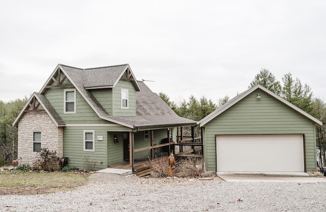 view of front of property featuring covered porch and a garage