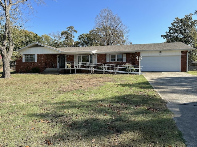 ranch-style home featuring a garage and a front lawn