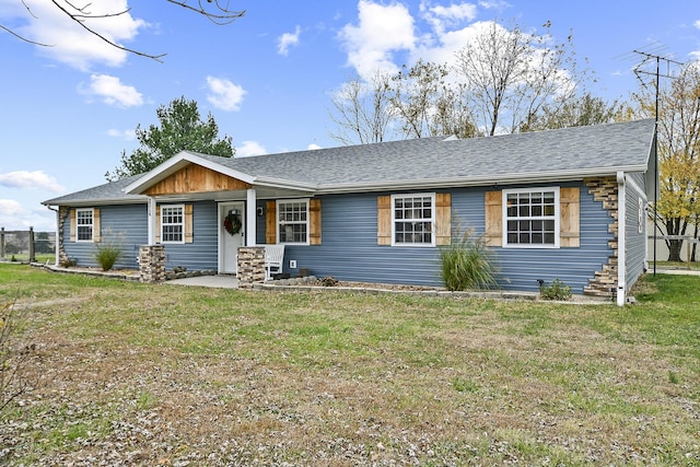 single story home featuring a front yard