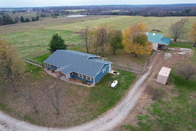 birds eye view of property with a rural view