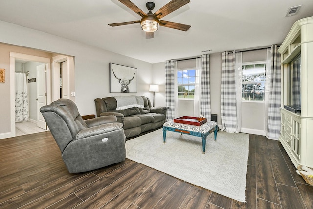 living room with dark hardwood / wood-style floors and ceiling fan