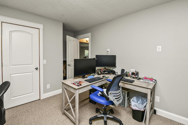 office with carpet and a textured ceiling