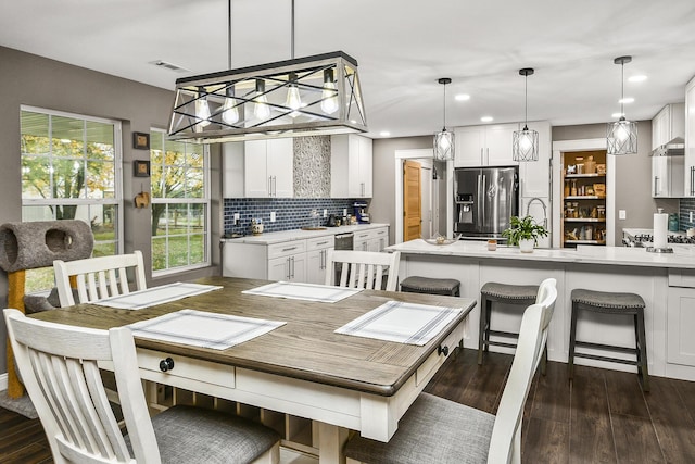 dining area featuring dark hardwood / wood-style floors