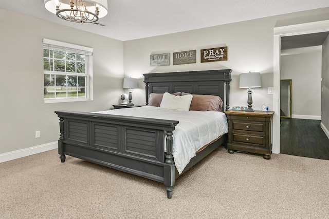 2314 State Highway 38, Elkland, MO 65644 - bedroom with light colored carpet and a chandelier