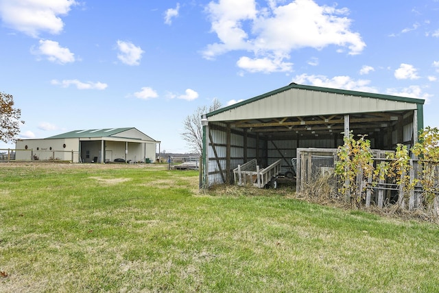 view of outbuilding with a yard