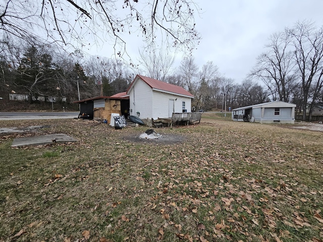 view of side of property featuring a wooden deck