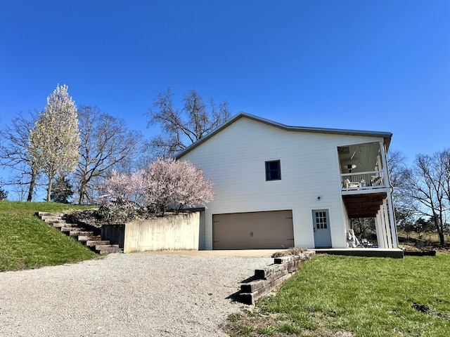 view of front of property with a garage and a balcony