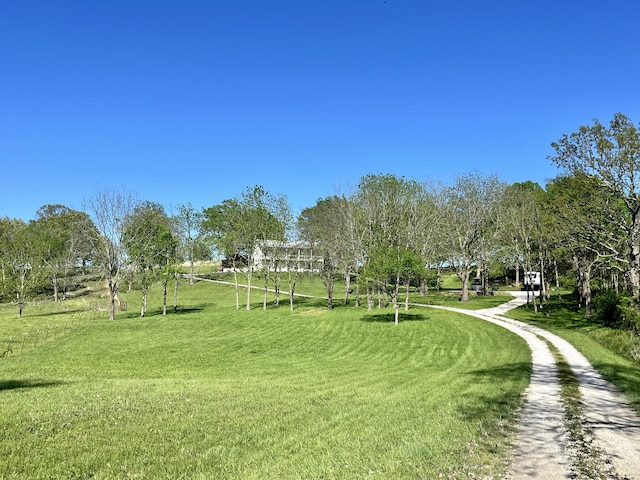 view of property's community featuring a lawn