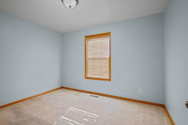 spare room with carpet floors