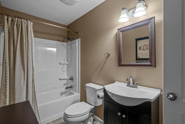 full bathroom featuring shower / bath combo, vanity, and toilet