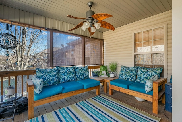 sunroom with ceiling fan and wood ceiling