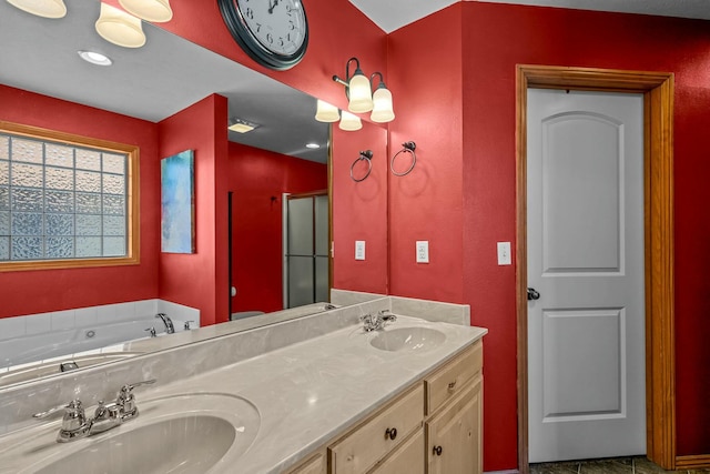 bathroom with vanity and shower with separate bathtub