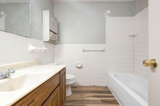 bathroom featuring hardwood / wood-style flooring, tile walls, and a tub