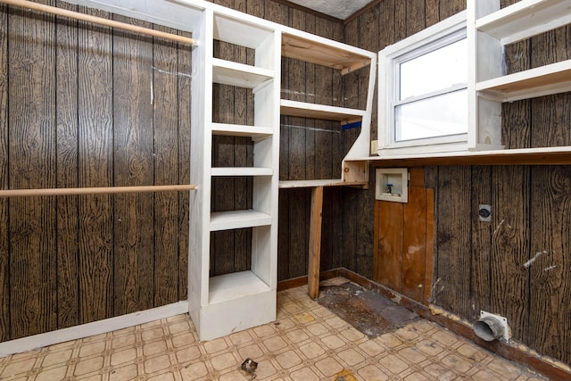 interior space featuring wood walls