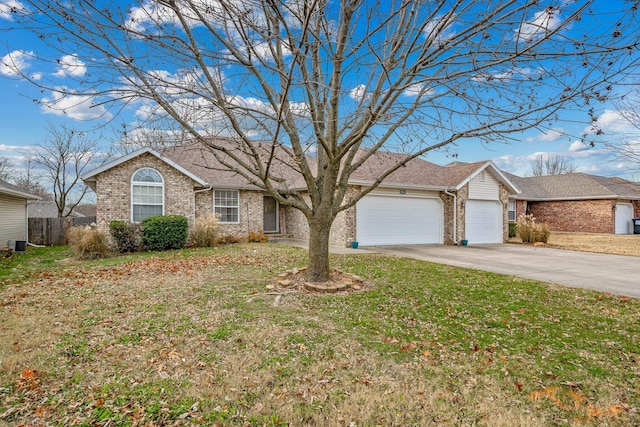 single story home with a garage and a front lawn