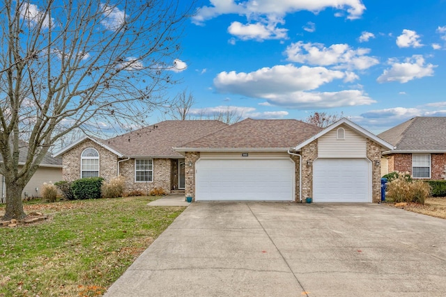 ranch-style house featuring a front lawn and a garage