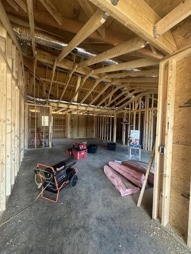 miscellaneous room with lofted ceiling