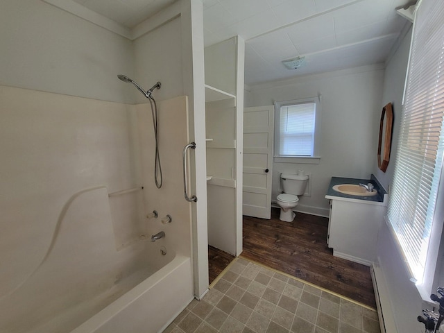 bathroom featuring toilet, ornamental molding, vanity,  shower combination, and a baseboard radiator