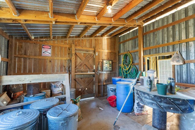 miscellaneous room with lofted ceiling and a wealth of natural light