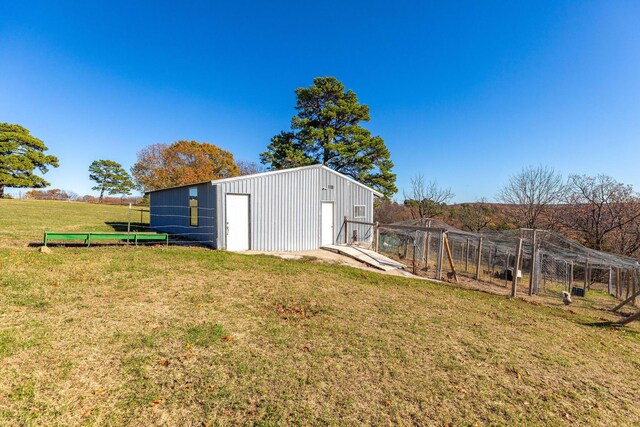 view of yard with a garage and an outdoor structure