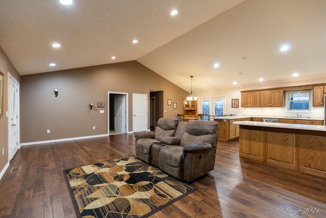 living room featuring dark hardwood / wood-style flooring, lofted ceiling, and sink