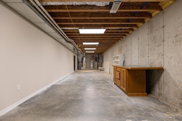 basement featuring water heater