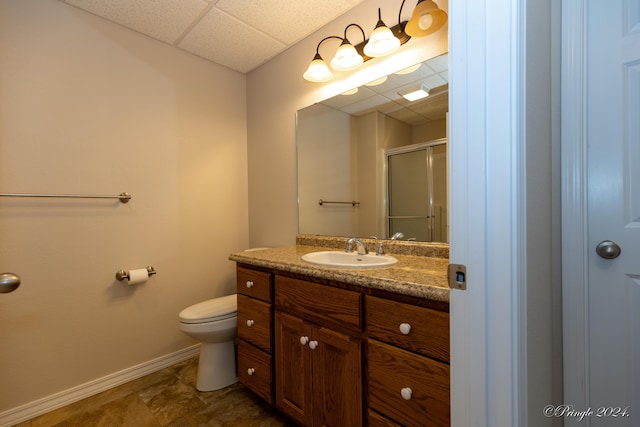 bathroom featuring vanity, an enclosed shower, and toilet