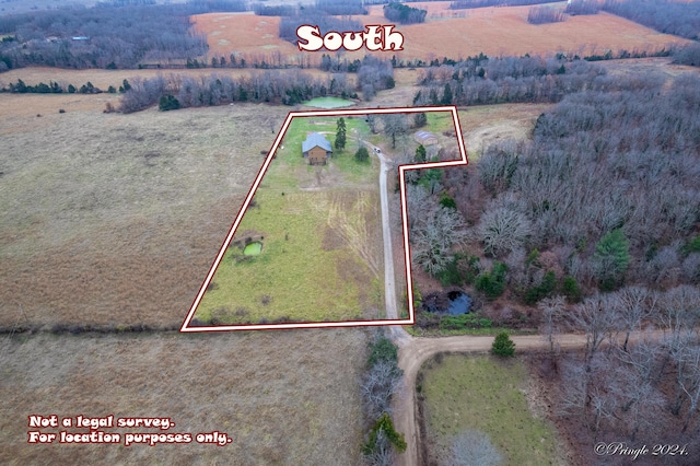 birds eye view of property with a rural view