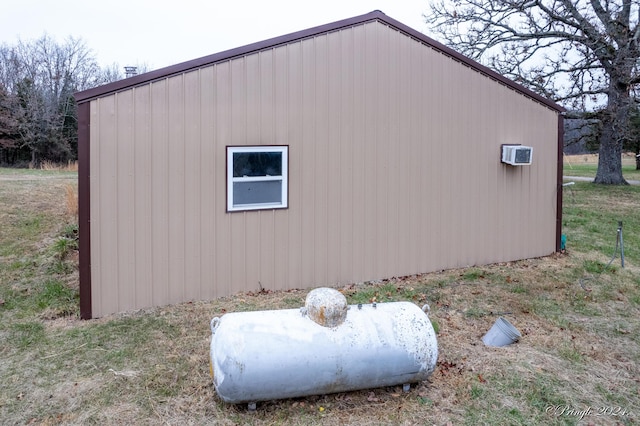 view of property exterior with a wall mounted air conditioner