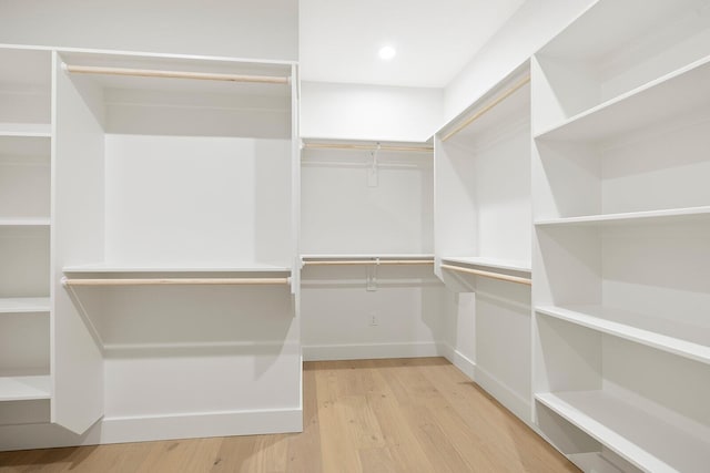 spacious closet featuring hardwood / wood-style floors