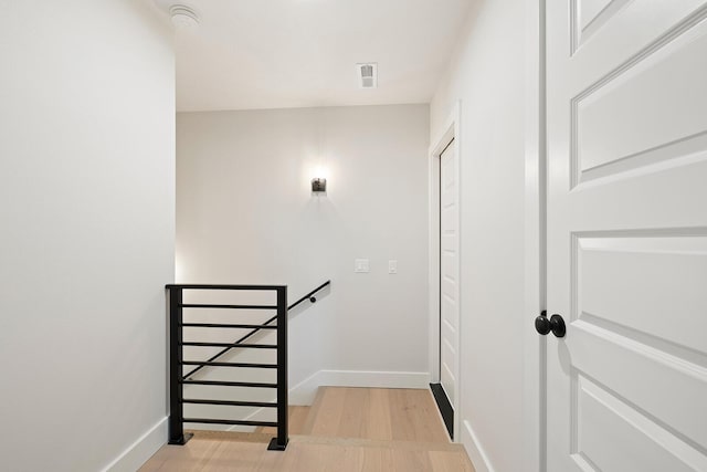 stairs featuring wood-type flooring