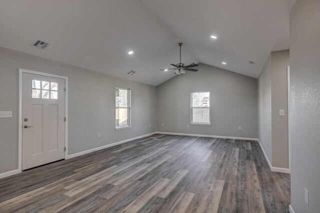 foyer entrance featuring ceiling fan, dark wood-type flooring, and lofted ceiling