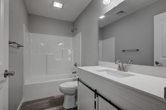 full bathroom featuring toilet, shower / tub combination, hardwood / wood-style flooring, and vanity