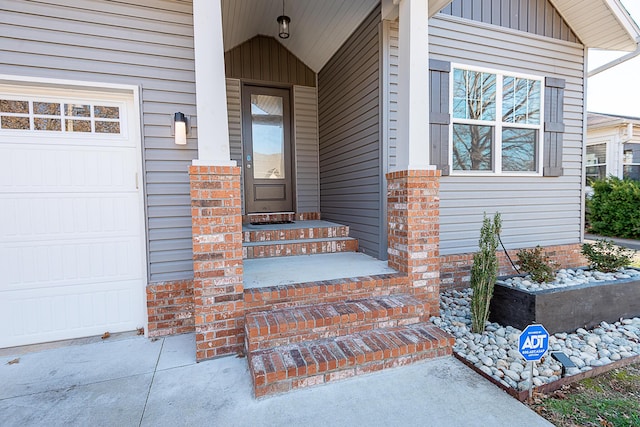 view of exterior entry with a garage