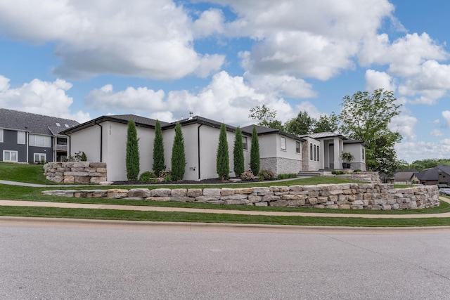 view of front of home with a front lawn