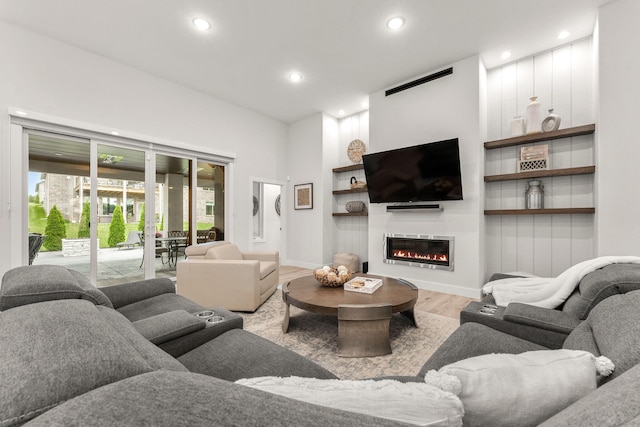 living room with light hardwood / wood-style flooring