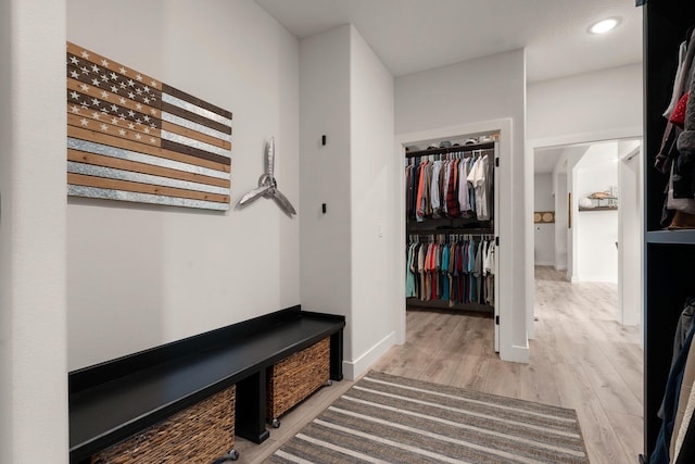 hallway with light wood-type flooring