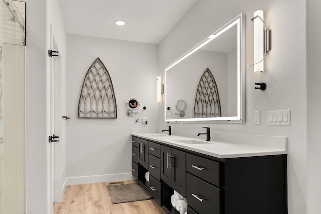 bathroom featuring hardwood / wood-style floors and vanity