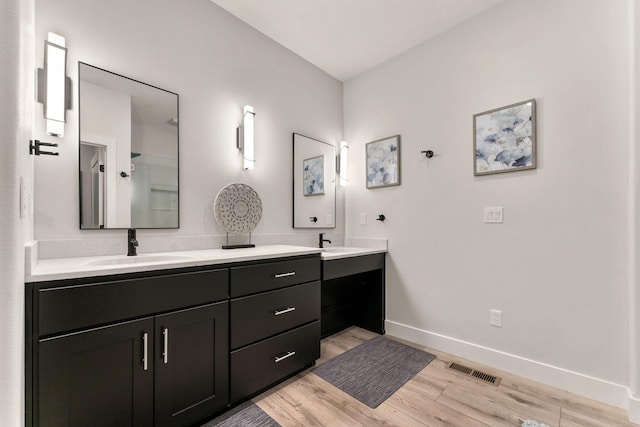 bathroom featuring hardwood / wood-style floors and vanity