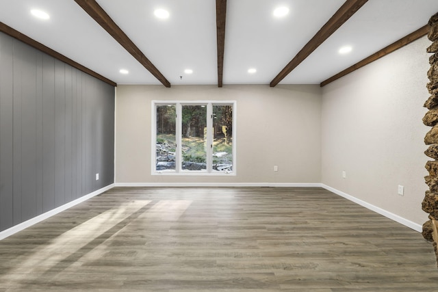 unfurnished room featuring beamed ceiling, recessed lighting, wood finished floors, and baseboards