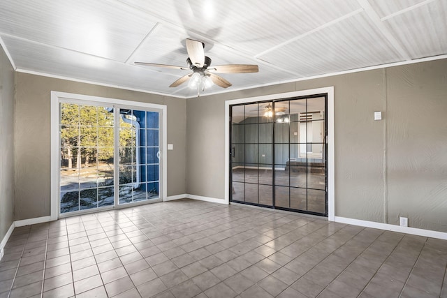 unfurnished room featuring ceiling fan, ornamental molding, and baseboards