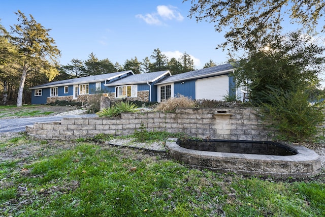 single story home with an attached garage